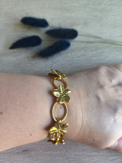 bracelet en acier inoxydable avec fleurs tropicales ou fleurs du bonheur, couleur doré