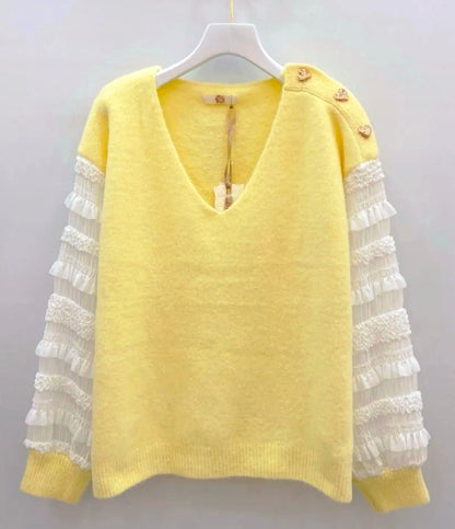 Pull jaune à manches plissées et boutons dorés